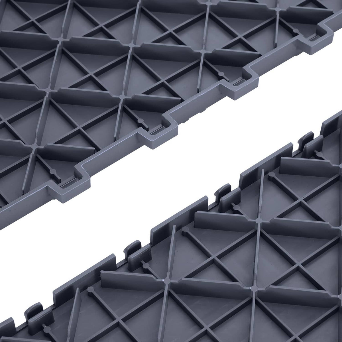 Close-up of interlocking garage floor tile connectors and underside diamond lattice