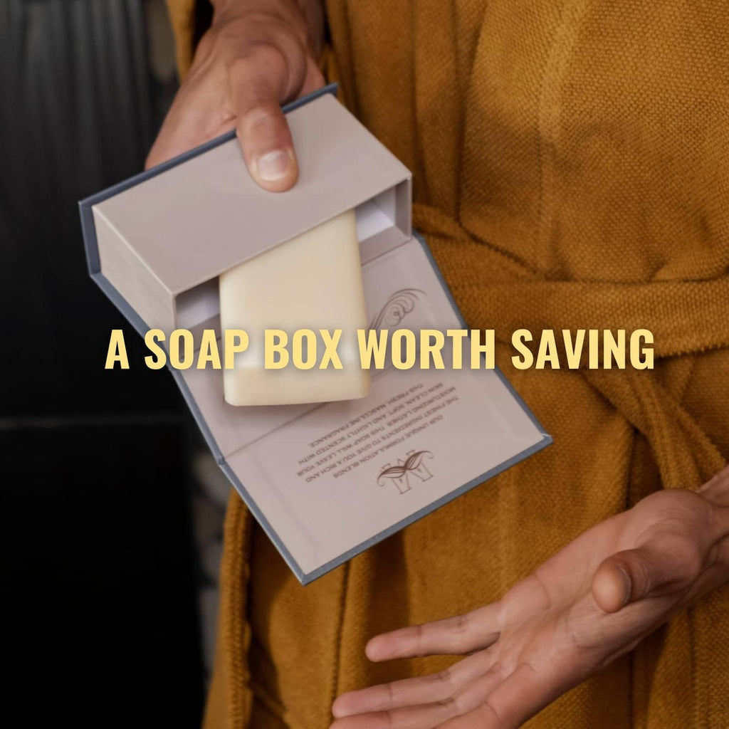 Man Bar soap box held in hands on mustard sweater