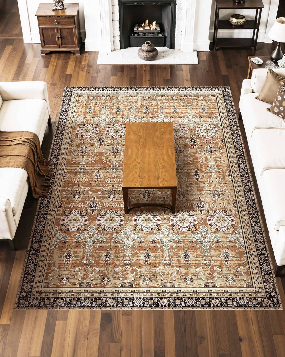 Vintage-style area rug with ornate floral and medallion pattern in tan, beige, and dark trim