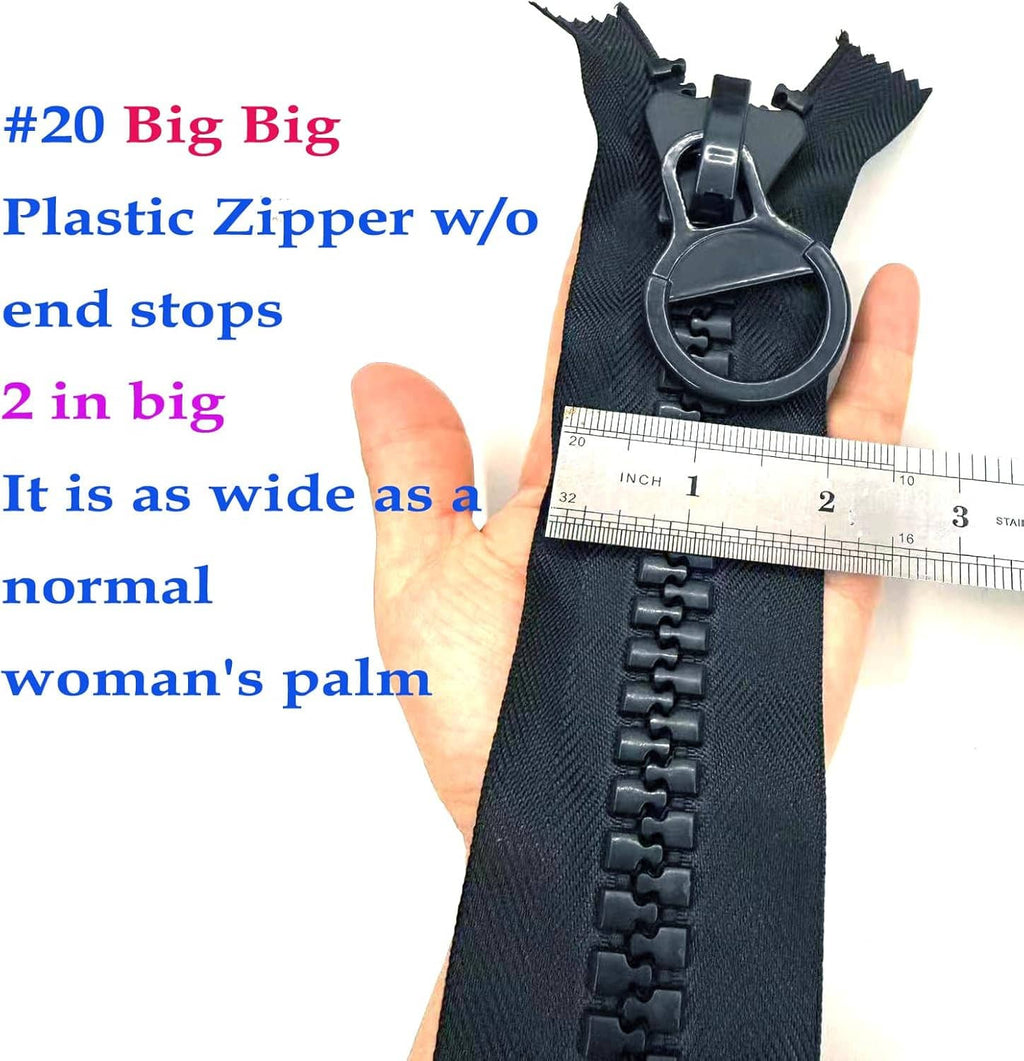 Black plastic zipper with large pull tab shown next to a ruler for scale.