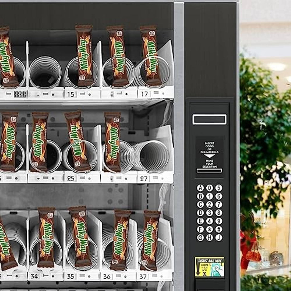 Snack vending machine stocked with Milky Way bar packs