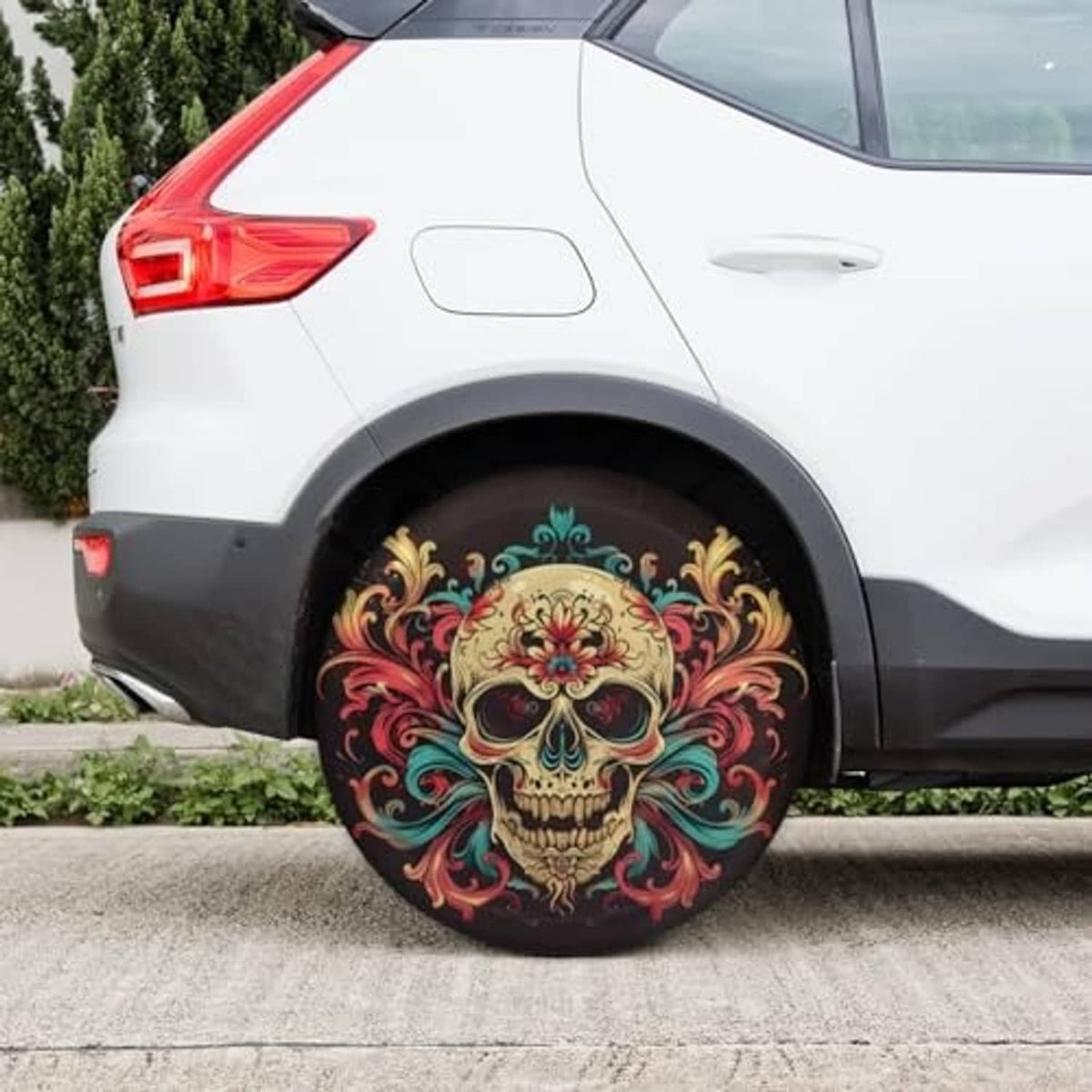 17-inch spare tire cover on rear wheel, black base with colorful skull and floral details