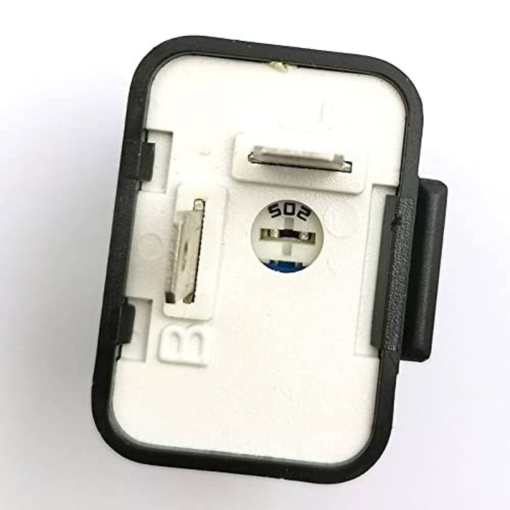 Flasher relay unit underside showing white plastic base and metal contact prongs