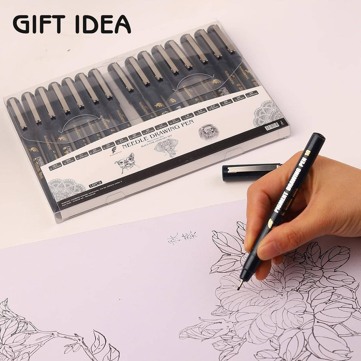 Needle drawing pen set with box packaging and hand drawing floral sketch