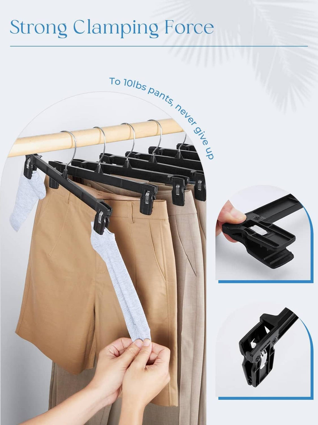 Black clip pant hanger securing pants with clamp grip and side hook
