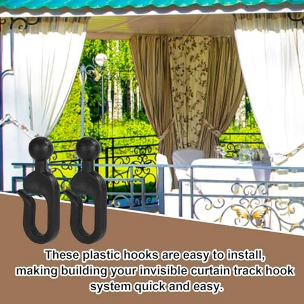Black curtain track hooks on a rod holding outdoor sheer curtains