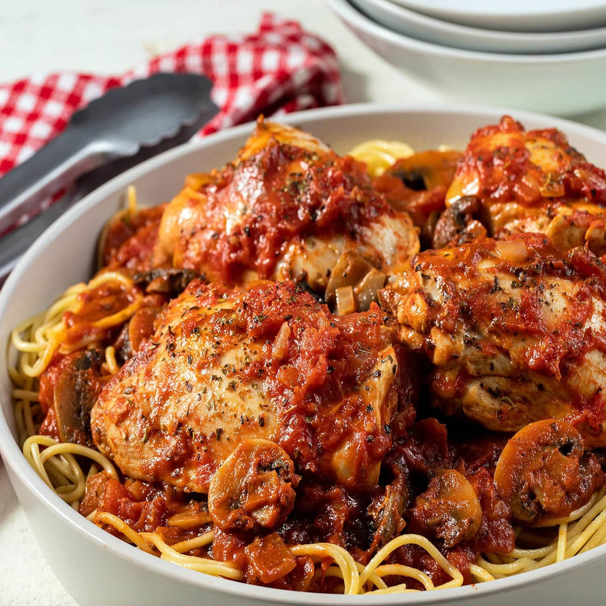 Plate of spaghetti with Italian mushroom-style sauce, mushrooms, and meatballs