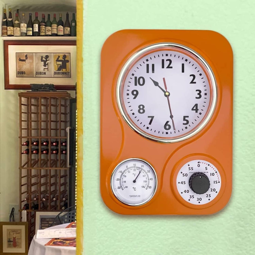 Orange retro kitchen wall clock with analog time plus thermometer and humidity gauges