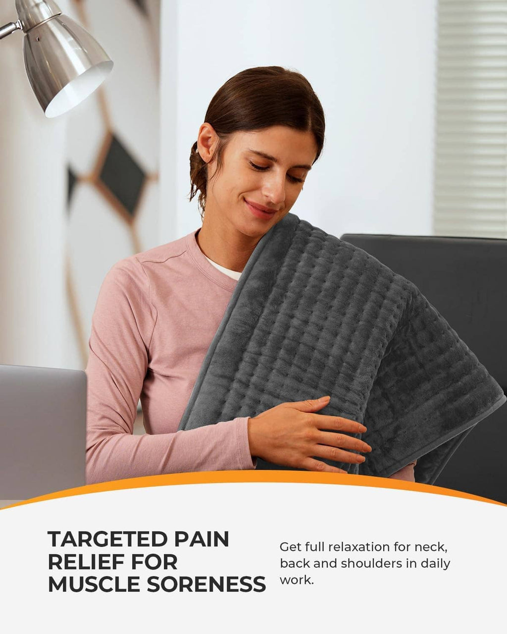 Gray heating pad held against the body for neck and shoulder comfort.