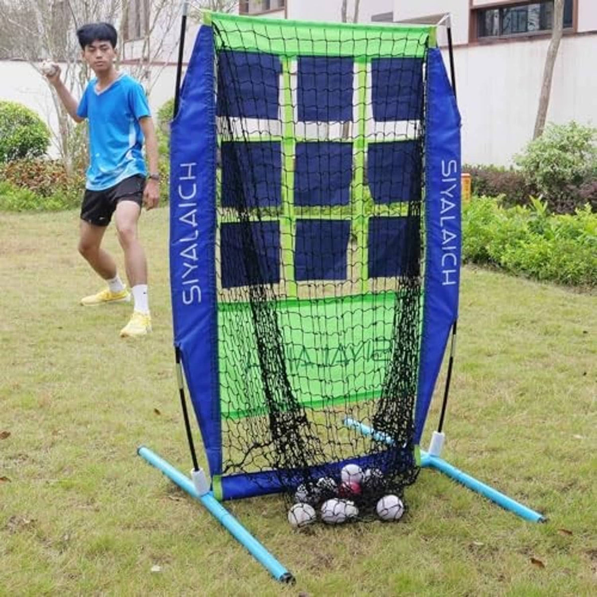 Portable target net with blue frame and green grid, with balls inside lower mesh