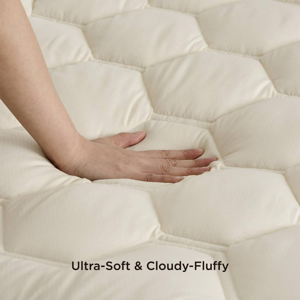 Light beige quilted mattress pad top with soft, puffy stitched squares