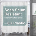 Frosted white plastic shower curtain liner with reinforced top grommets and metal rings