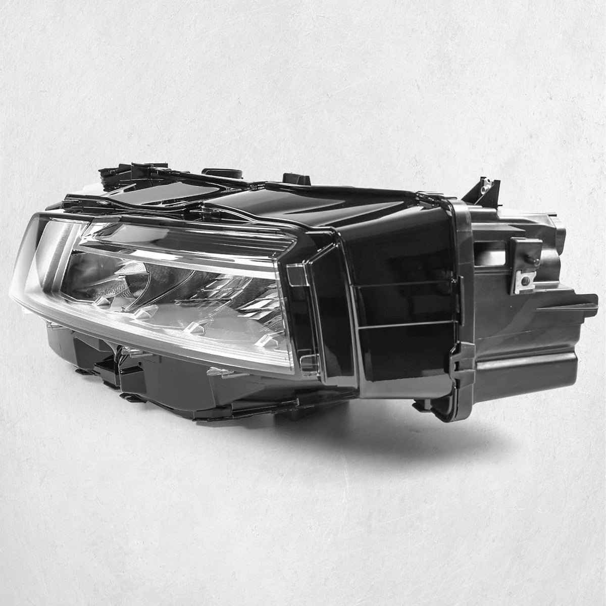 LED headlight assembly in side angle with clear lens and black mounting brackets