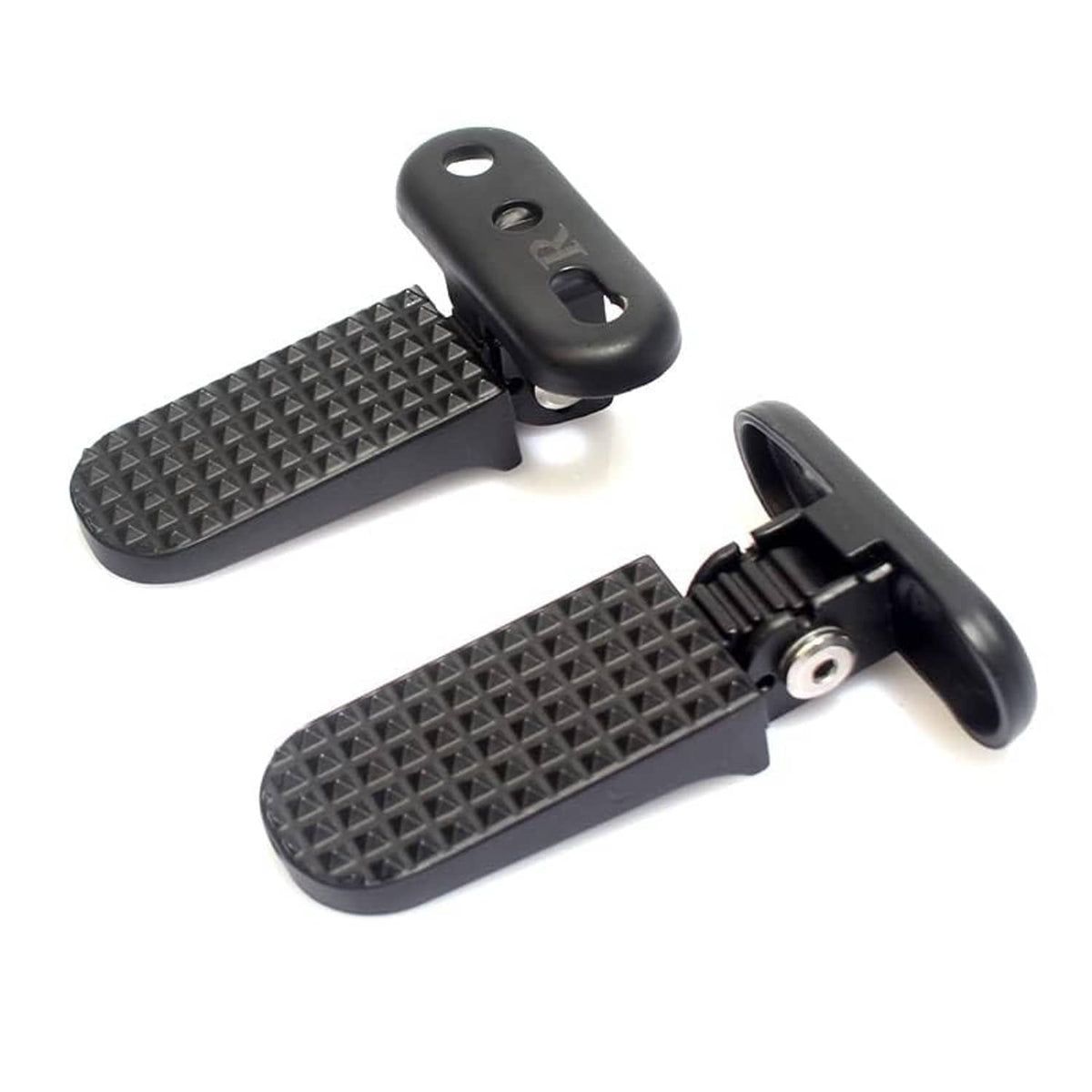 Rear motorcycle footrests with textured tread pads and side mounting bracket