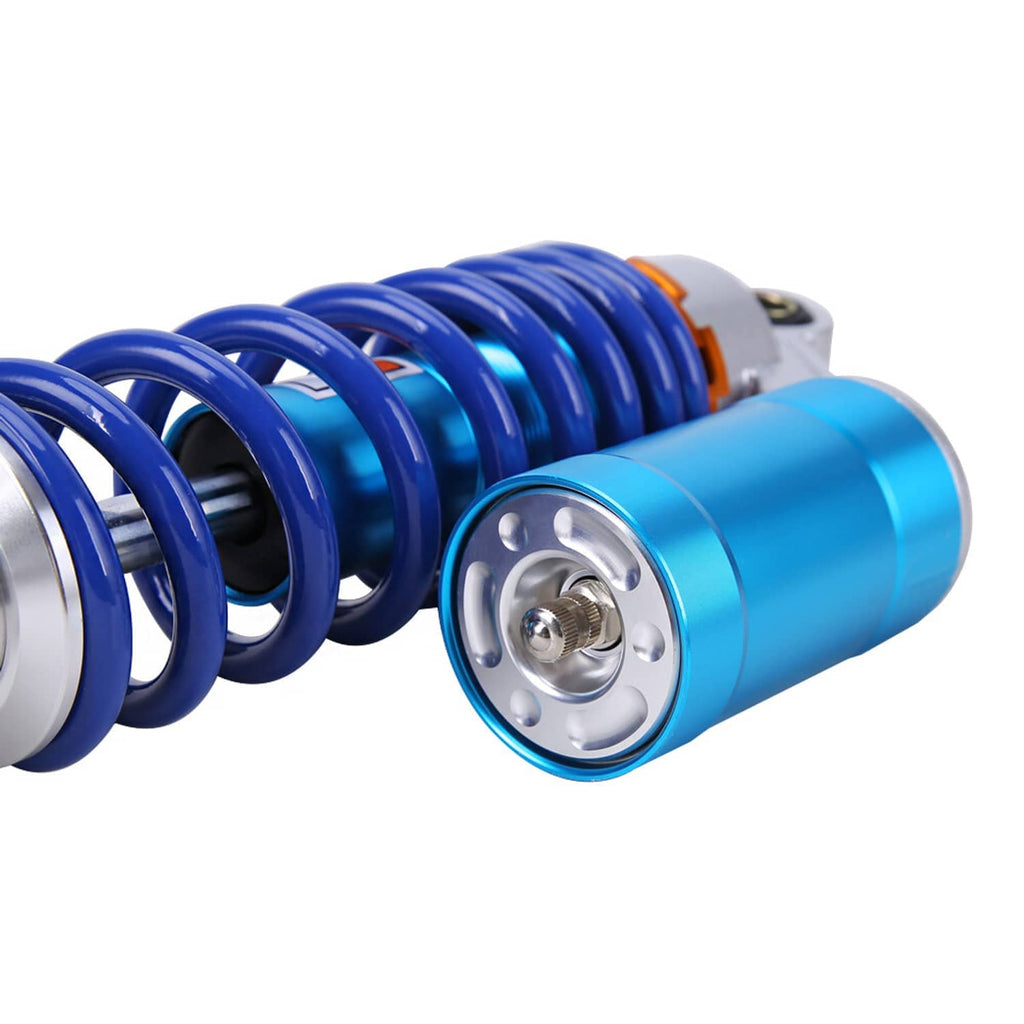 ATV rear shock end cap close-up with blue reservoir and blue coil spring detail
