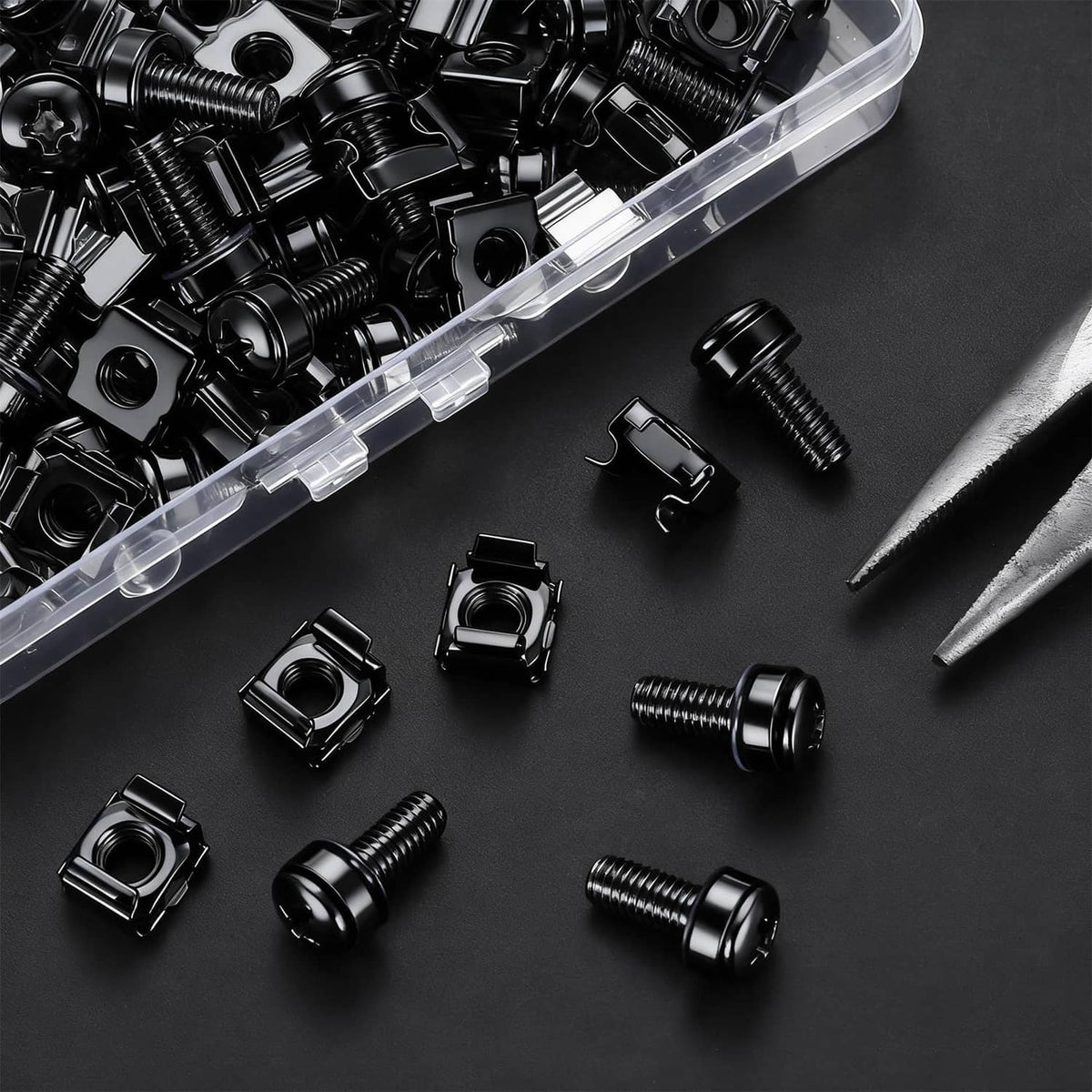 Black rack mount screws and cage nuts, scattered set on dark surface