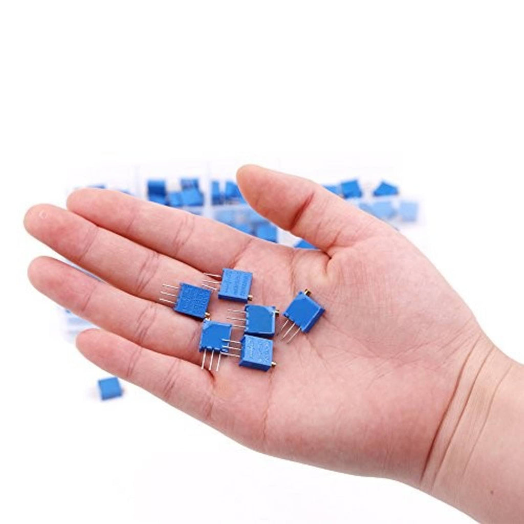 Hand holding several blue multiturn trimmer potentiometers with 3-pin leads