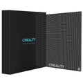 Creality 3D printer glass bed platform, dark textured square panel, angled view