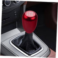 Red 5-speed gear shift knob on black leather boot with silver shifter trim