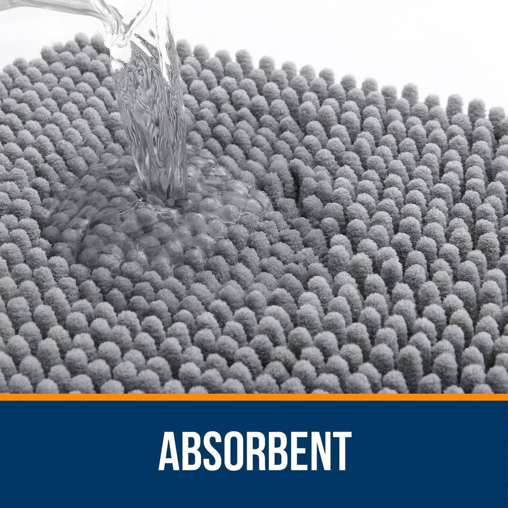 Grey chenille bathroom rug with water splashing on plush surface