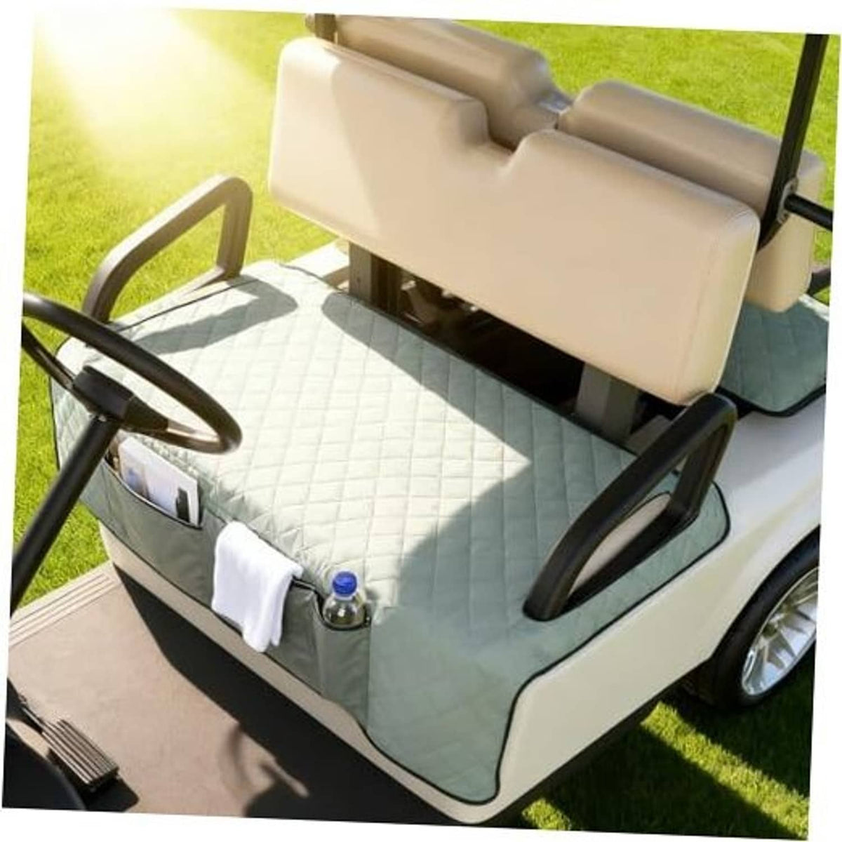 Grey golf cart seat cover blanket on bench with quilted surface and front towel