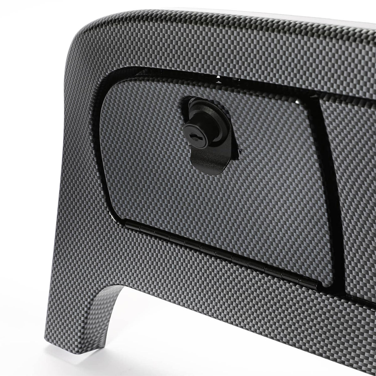 Close-up of dark gray carbon-fiber dash cover with corner access panel