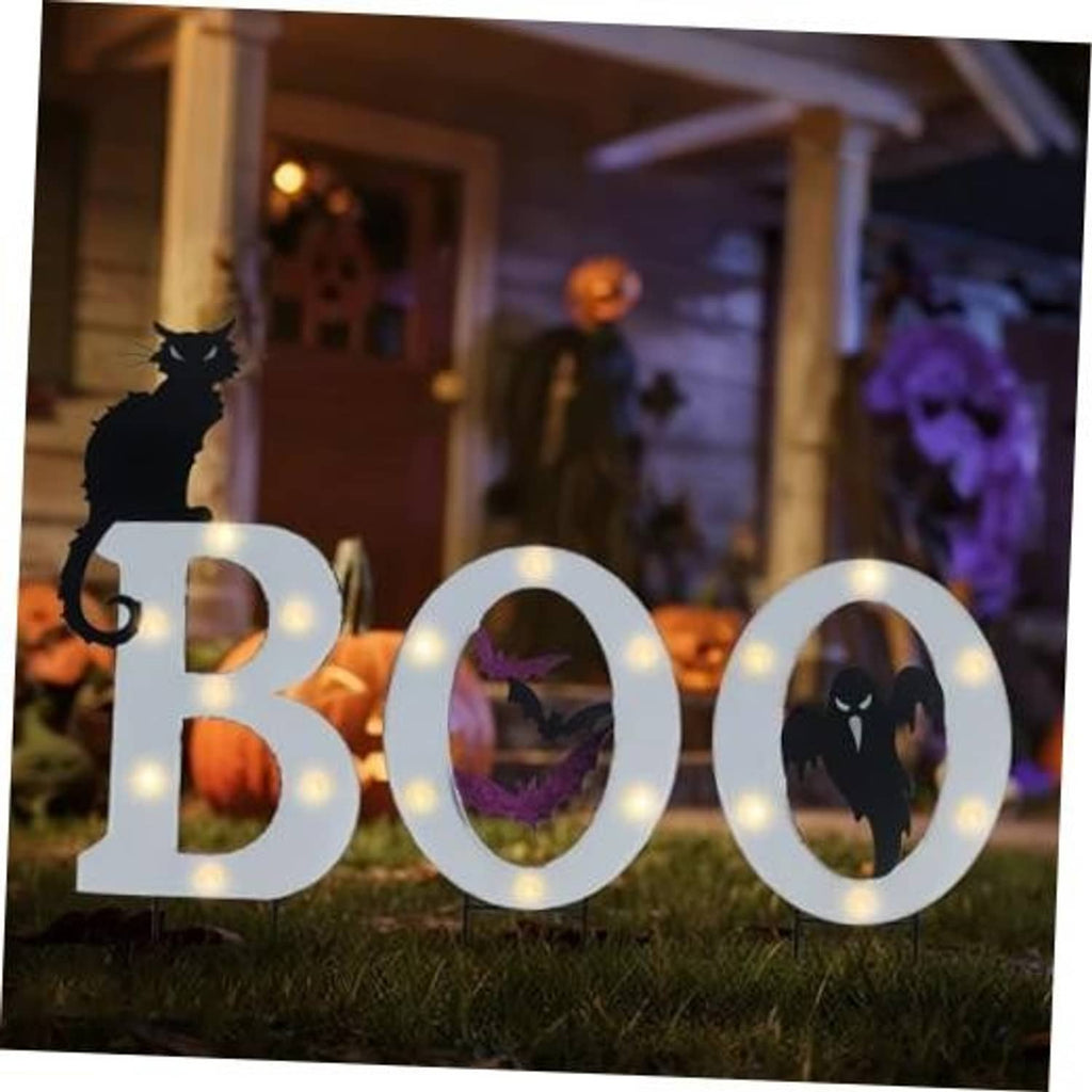 Outdoor Halloween solar yard sign set with glowing BOO letters and spooky silhouettes
