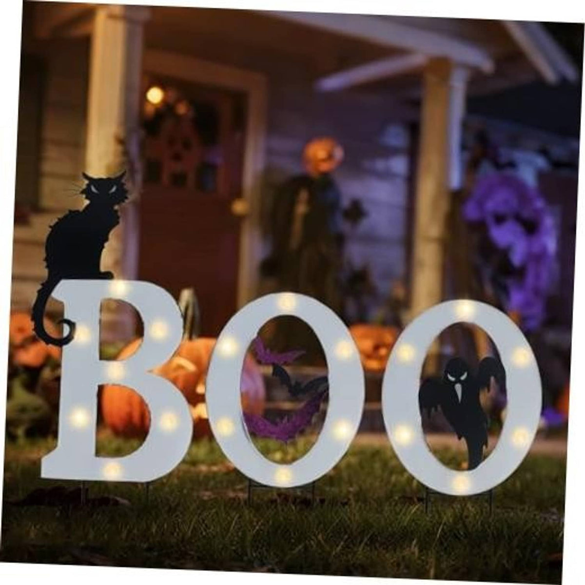 Outdoor Halloween solar yard sign set with glowing BOO letters and spooky silhouettes
