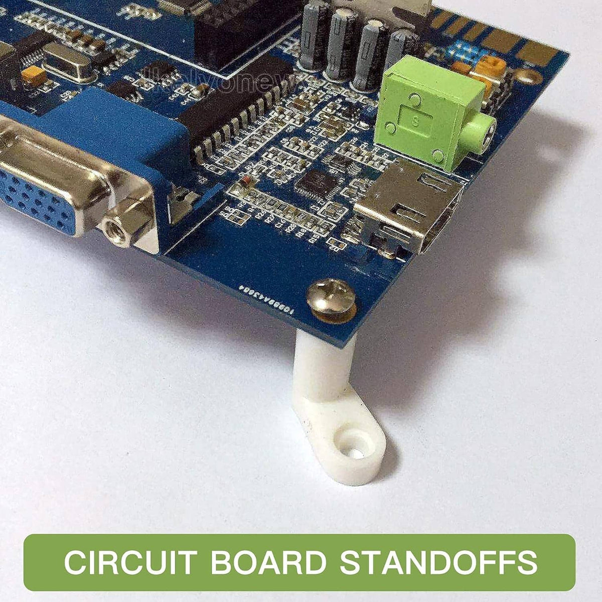 White plastic circuit board standoff with mounting screw installed on PCB