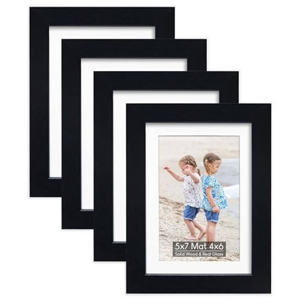 Set of four black wood picture frames with white mat and real glass front