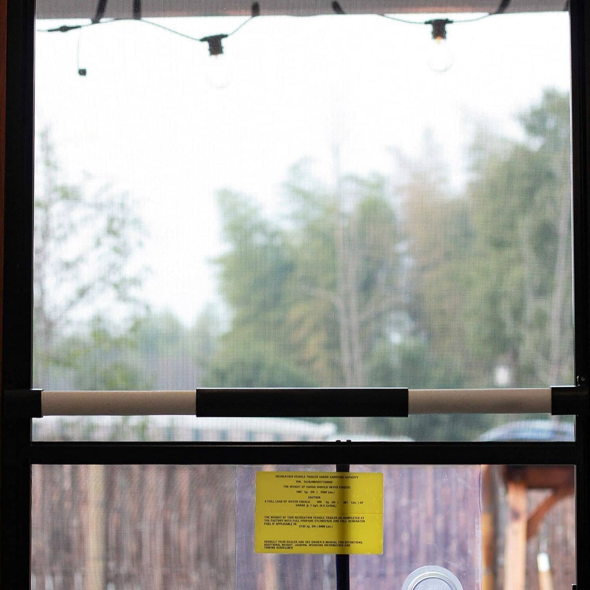RV screen door cross bar handle installed across window screen opening