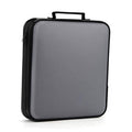 Grey DVD/CD storage case with black zipper and top carry handle.