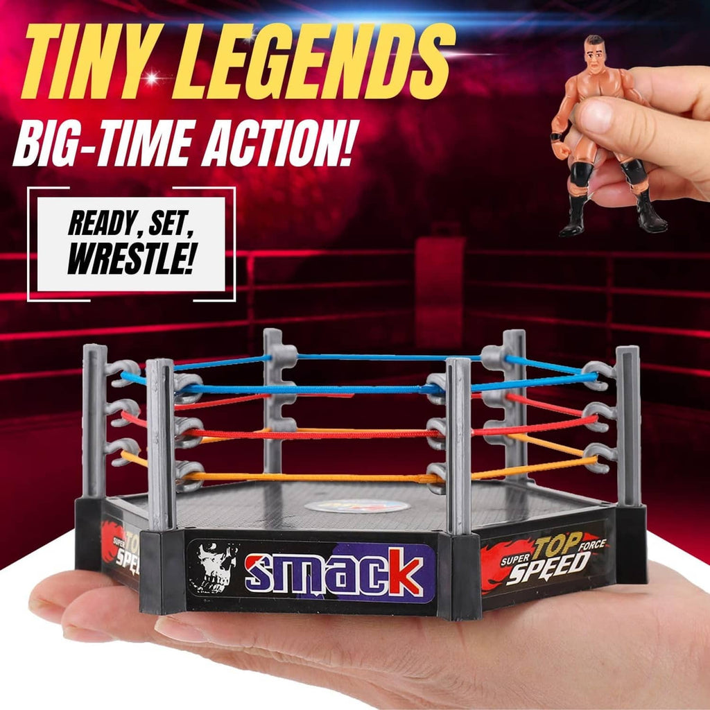 Mini wrestling ring in a hand with a wrestler action figure above the ropes