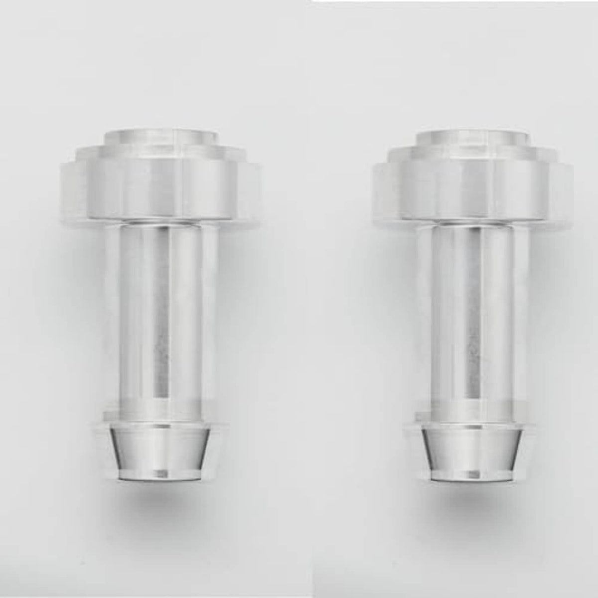 Two silver hose barb tail nipples with open bores and flanged weld ends