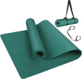 Teal non-slip yoga mat rolled up with attached carrying strap and looped ends