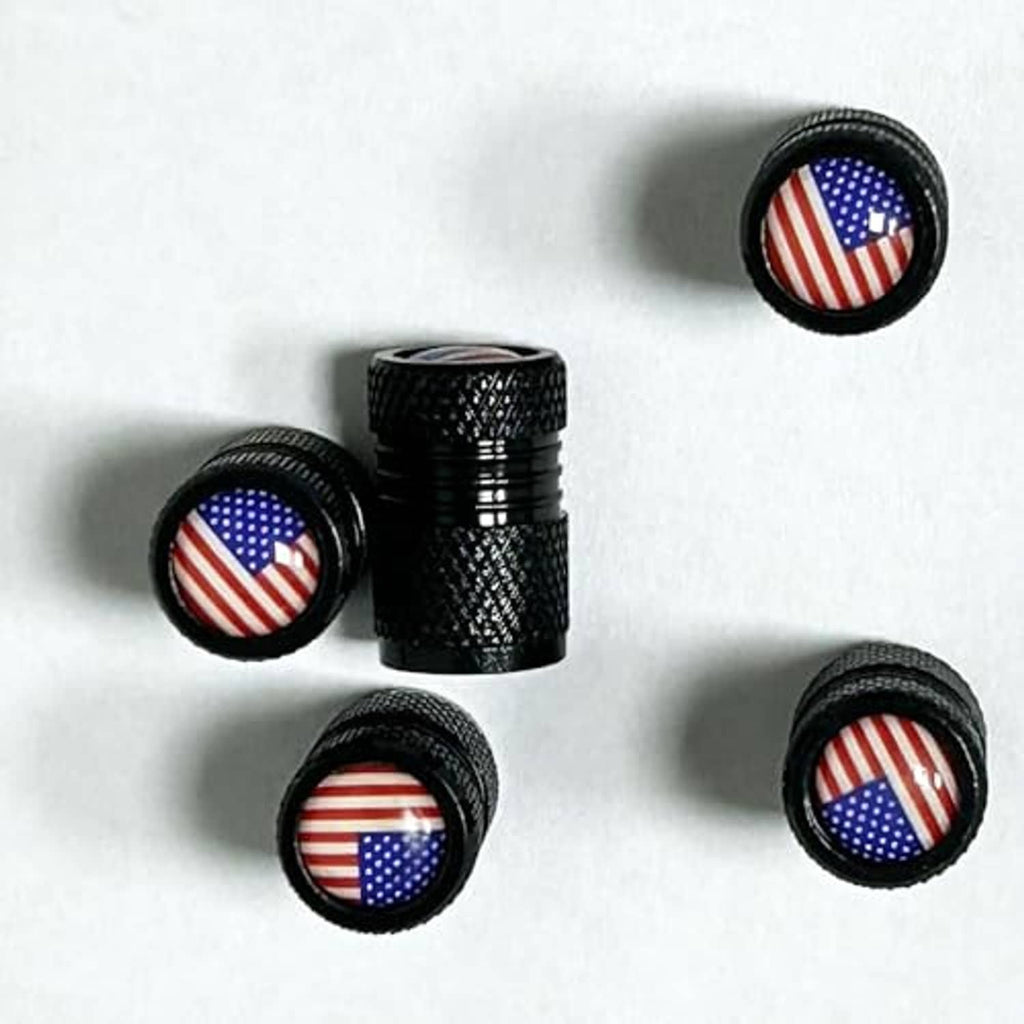 Multiple black knurled valve stem caps with round US flag center inserts