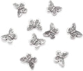 Antique silver butterfly spacer beads with raised wing detailing, metal set