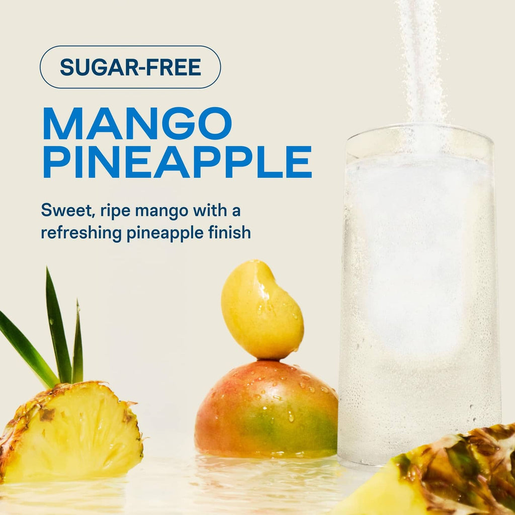 Sugar-free mango pineapple hydration drink in a glass with pineapple and mango pieces