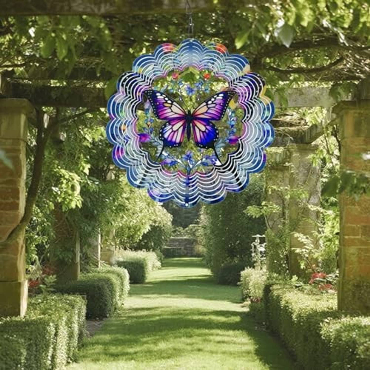 Butterfly wind spinner with multicolor scalloped rings hanging over a garden path.