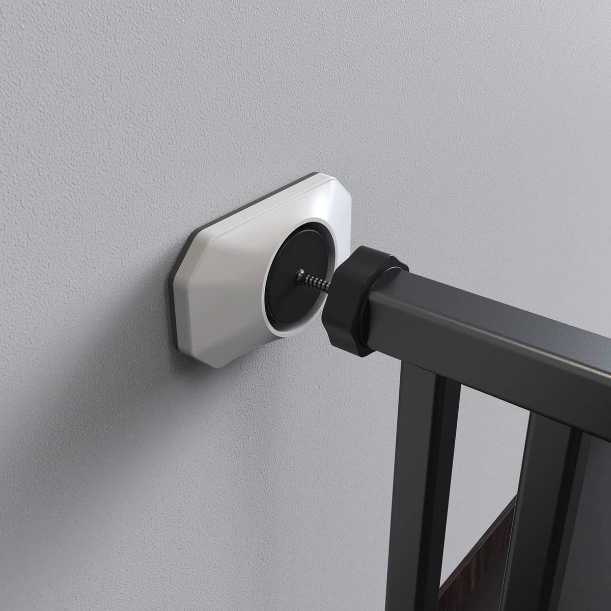Baby gate wall protector mounted on wall with black adapter and screw into base
