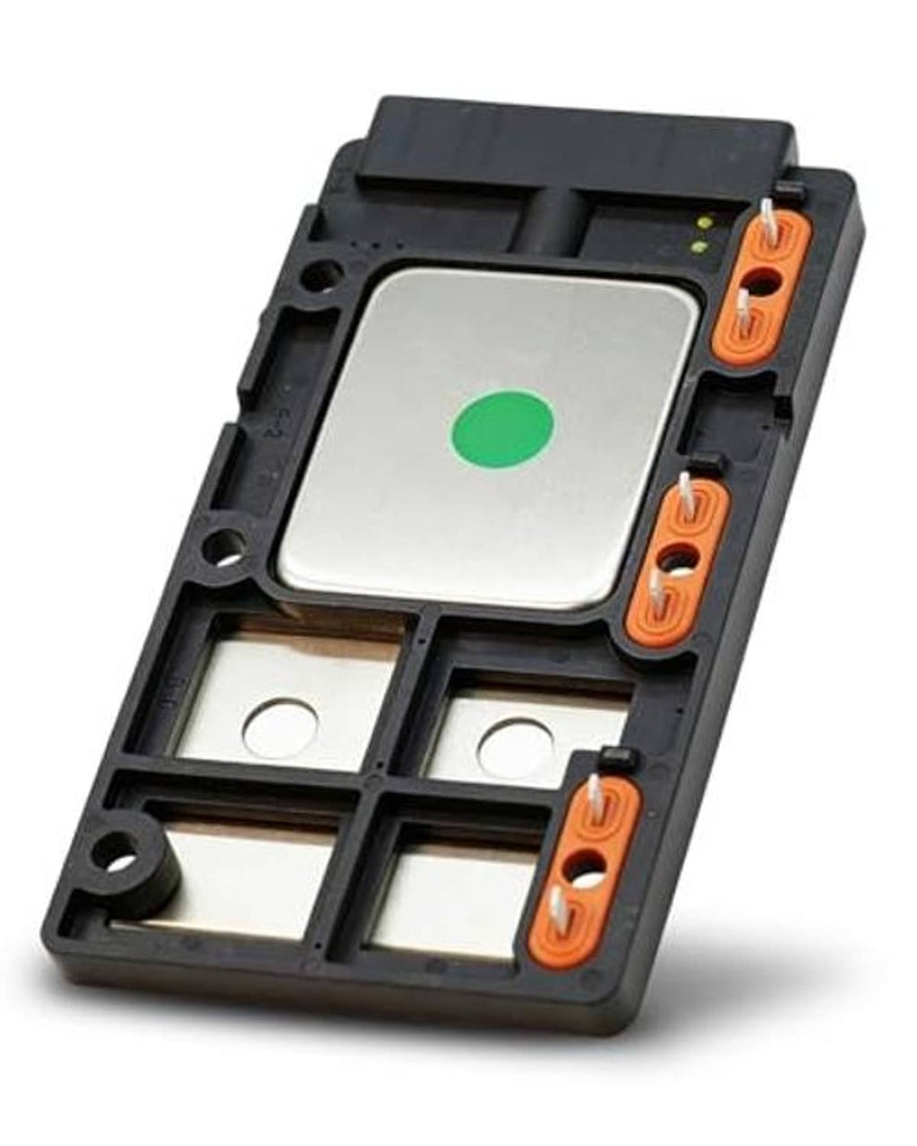 Engine ignition control module angled view with green center plate and orange terminal blocks