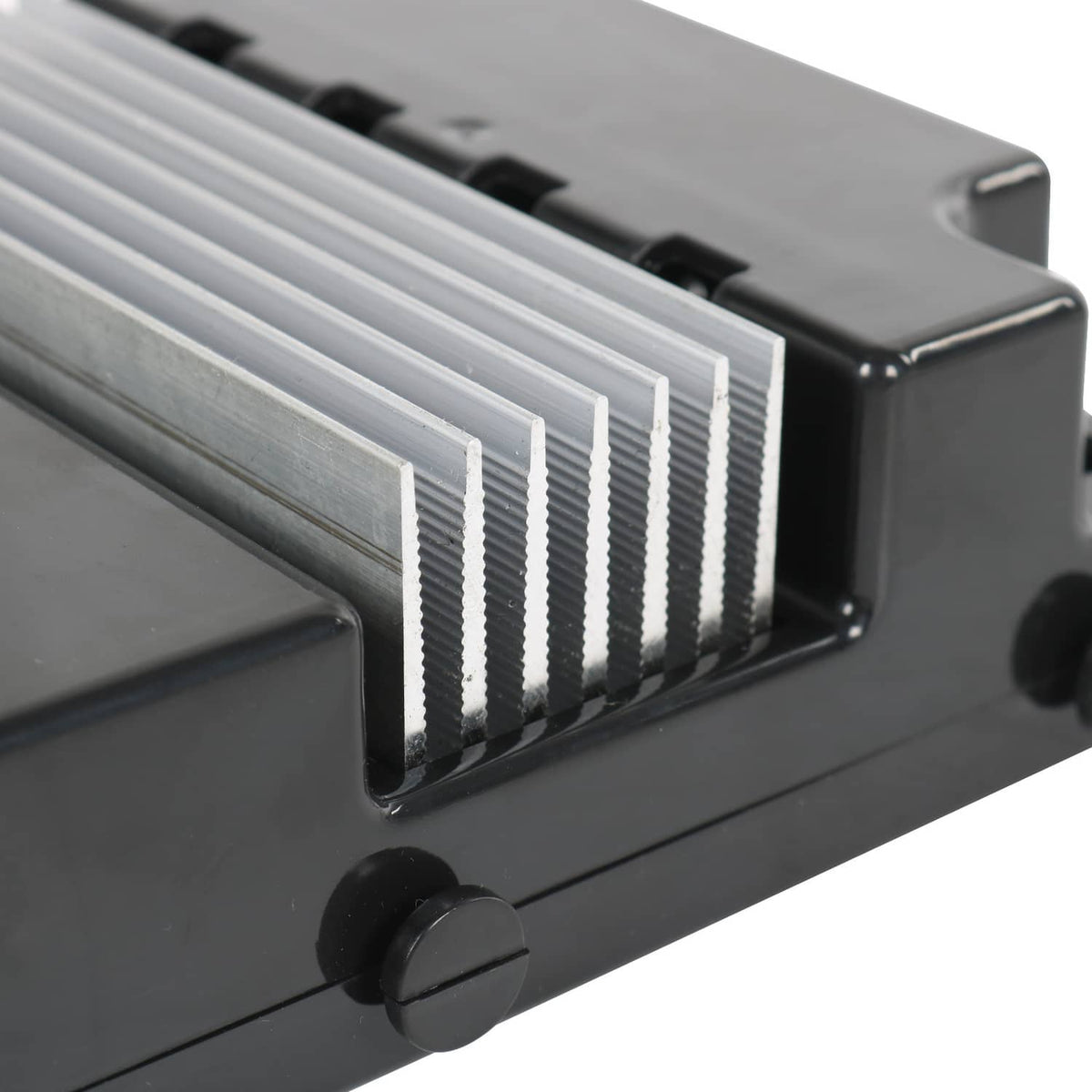 Black controller assembly with ribbed heat sink fins on the housing
