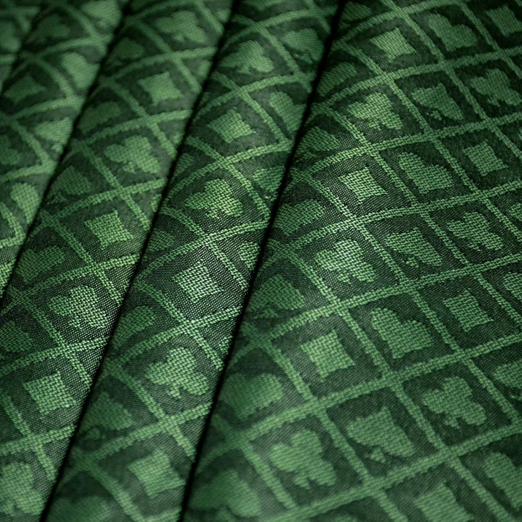 Folded green poker table speed cloth with geometric diamond pattern