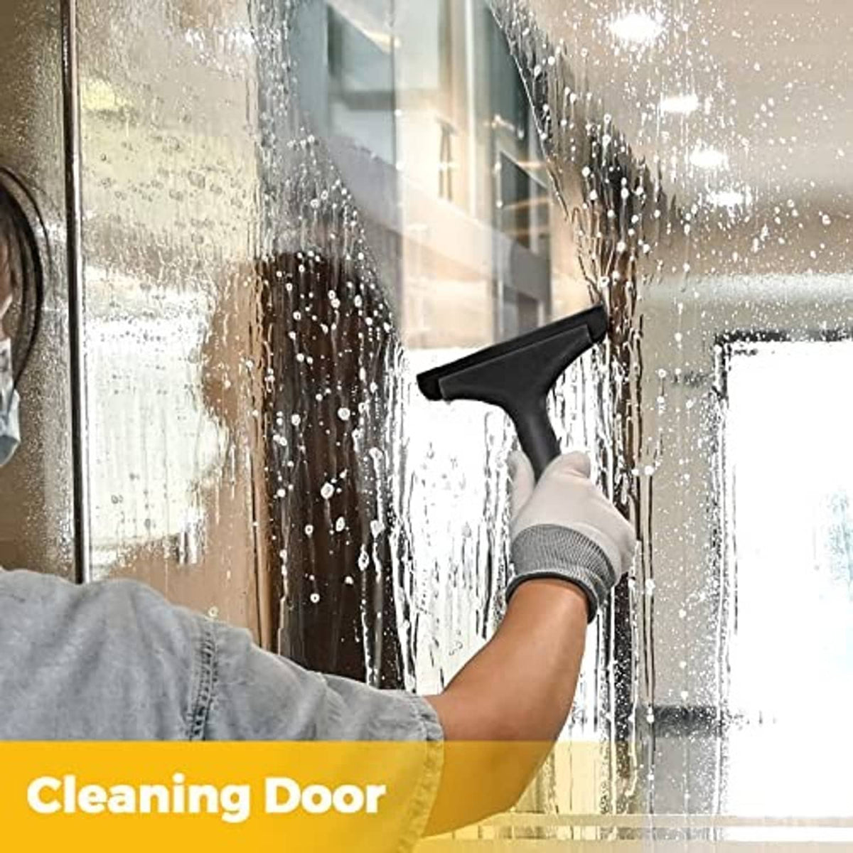 Black silicone squeegee for door window glass with curved blade removing droplets.