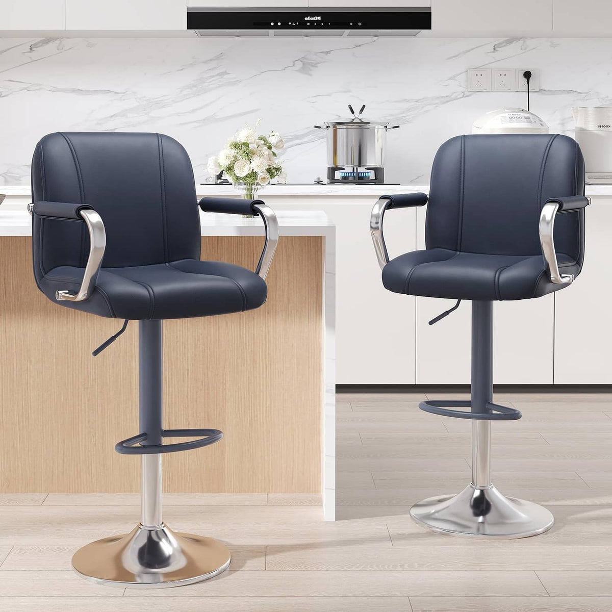 Set of 2 blue counter-height stools with backs, chrome base, and armrests