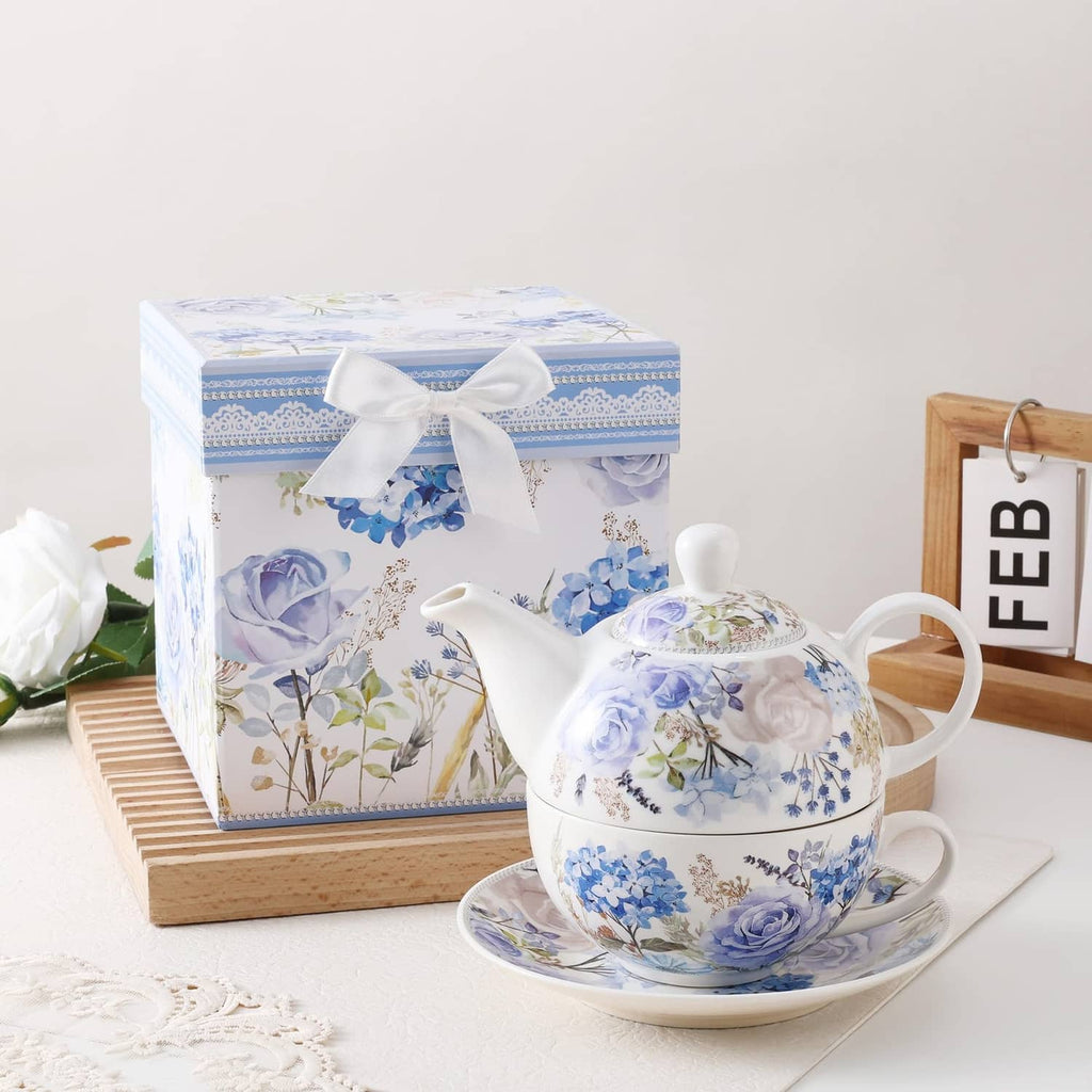 Porcelain tea for one set in blue floral gift box with teapot and cup.