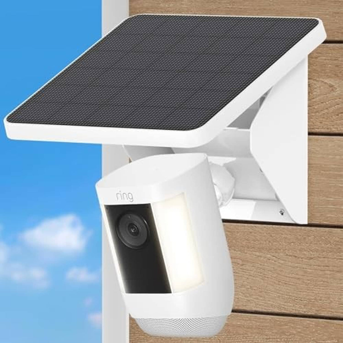 Wall-mounted solar charging mount with textured black panel and Ring camera, close view