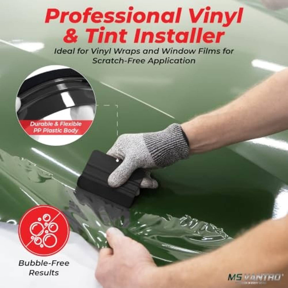 Hand using a black felt-edge squeegee to smooth vinyl wrap on a surface