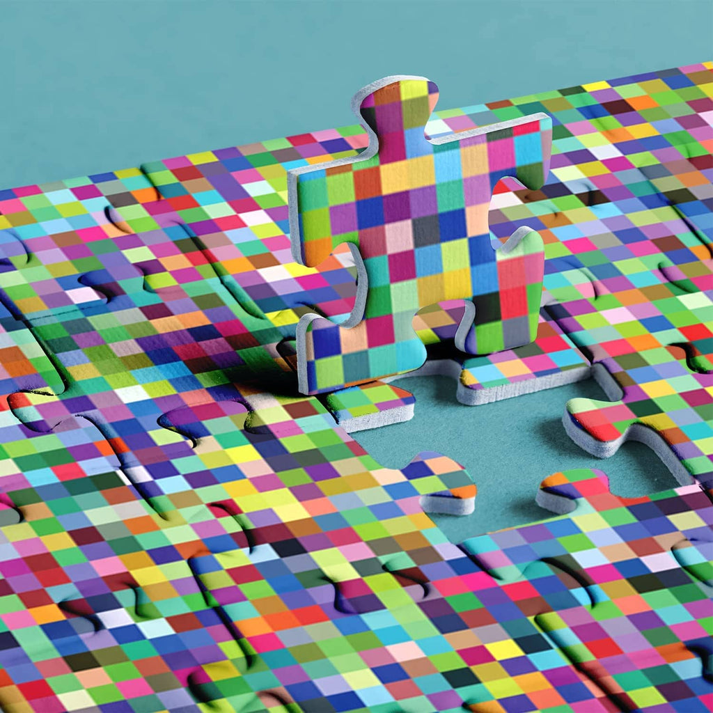 Loose jigsaw puzzle pieces in a multicolor mosaic pattern