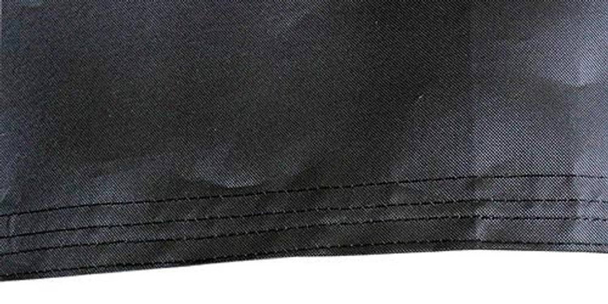 Close-up of black flag fabric seam with double-stitched hem